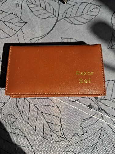 Brown leather covered razor - covered,