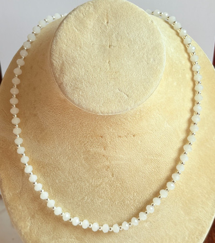 White coloured faceted - white,