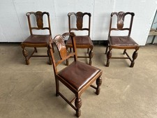 A set of 4 1930’s carved oak dining chairs