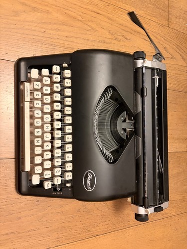 Chums working retro typewriter