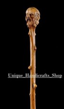 Hand carved old men handle