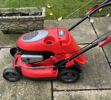 Petrol lawnmower, Briggs & Stratton engine recently serviced by professionals.