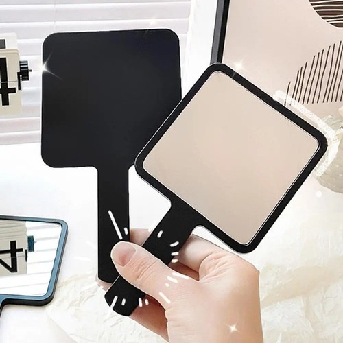 Hand held makeup mirror - hand,