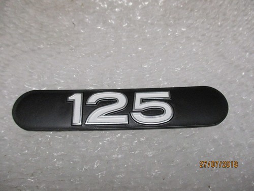 125 exhaust heat - shield, badge