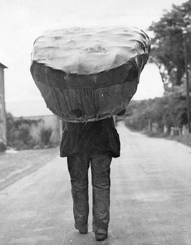 Coracle fisher carries boat - carries, 'boat'