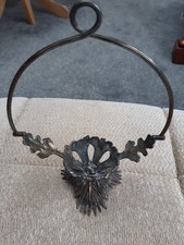 Vintage hand-forged metal Candle Stick Holder with decorative floral leaf motif.