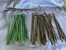 27 Garden Pegs . Metal . Mixed Condition. Used