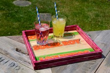 Colourful wooden trays made from fruit & veg boxes with a distressed pine frame