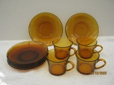 4 X Vintage Duralex Orange Glass Cups And 6 X Saucers.