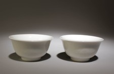 Pair white glazed cups - a,