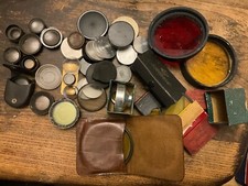old camera filters and lens and lens caps