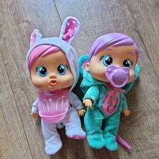 TWO  CRY BABIES  TEAR DOLLS COMPLETE WITH DUMMY ,BIB,, ONEZYS AND CRY..