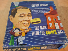 THE MAN WITH THE GOLDEN UKE