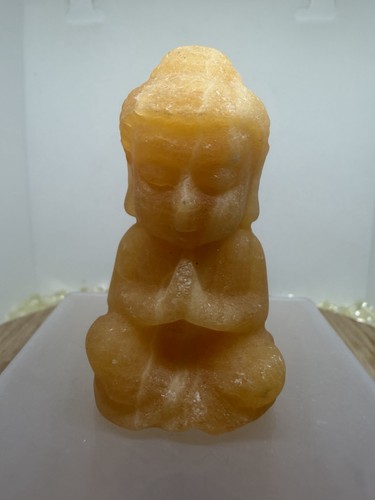 Orange calcite buddha - calcite,