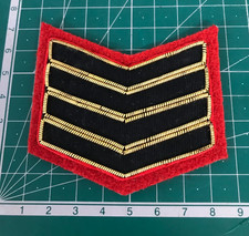Military Rank Insignia Four Black Chevrons Edged in Gold Bullion on Red M2920