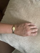 Timex women's watch. Small hexagon gold face. Gold band