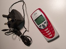 vintage Nokia 8310 plus charger, white and red