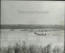 1964 Press Photo Man in a boat