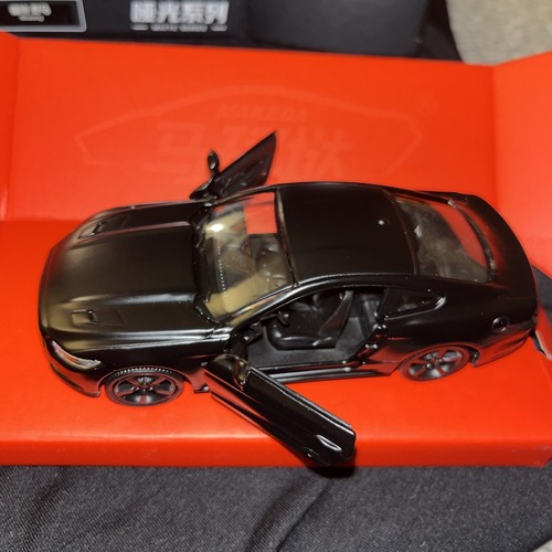 Black pull back diecastmustang - pull,