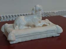 A small Minton Parian Spaniel on a cushion 4"