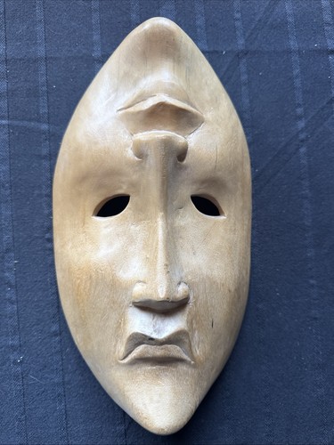 Two faced carved - faced, face
