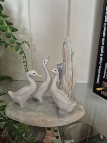 Nao lladro three - by, with
