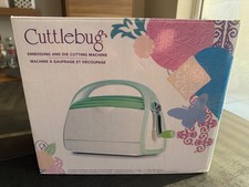 Cuttlebug Die Cutting & Embossing Machine in great condition, includes 4 folders
