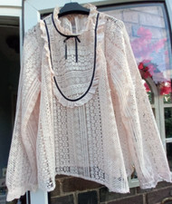Used pretty pale pink blouse with black trim to fit size UK 16.
