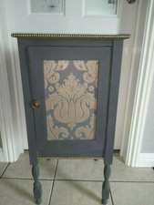 antique pot cupboard upcycled in chalk paint with black and gold wallpaper inser