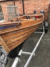Clinker Built Wooden Boat With Outboard Motor And Road Trailer