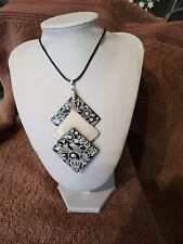 This classy Pendant in black and white will enhance  any outfit handcrafted