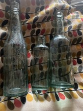 . 3 vintage bottles.green