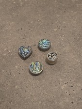Four small trinket / pill boxes with decorative shapes and tops