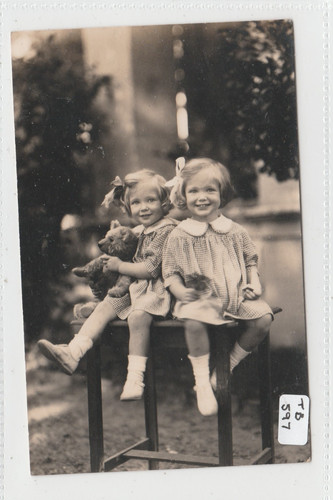 Two children sitting - two,