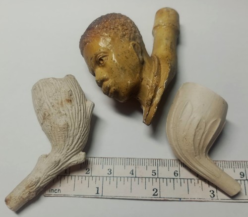 Three attractive clay pipe - three,