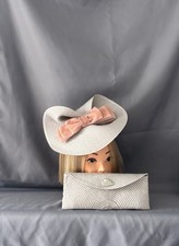 Stunning silver/grey Fascinator with pink bow and Matching Clutch Bag