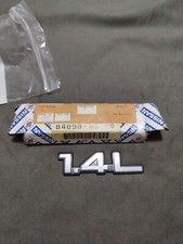 GENUINE 1980s NISSAN SUNNY 1.4 L REAR PLASTIC BADGE EMBLEM. 84898-63C60