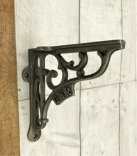PAIR OF "GWR" CAST IRON SHELF