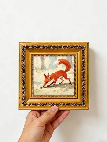 Red fox sniffing - acorn, in