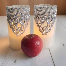 A Pair Of 2 Sillver Hollow Flameless Candles. Battery Operated