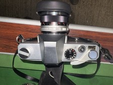 The product shown in the image is a Mamiya/Sekor 1000 Tl a 35mm single-lens