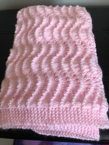 Pink hand knitted baby - hand,