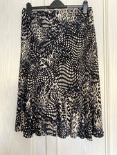 Skirt size 12. Black & Beige. 30 inches long. Godet Print. New with tags