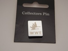 Wildfowl & Wetlands Trust pin badge silver background with logo