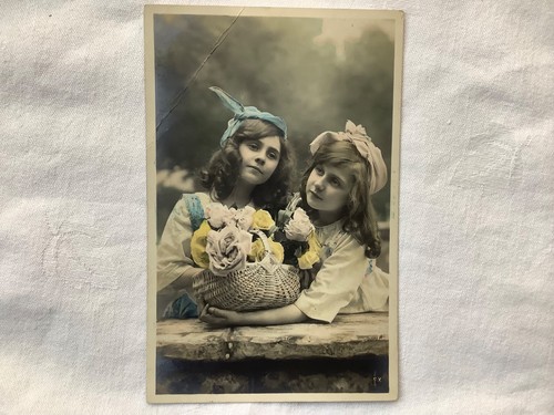 Two children holding basket - two,