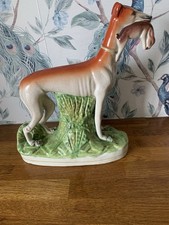19thC Staffordshire Greyhound or Whippet Dog with a Rabbit in its Mouth a/f