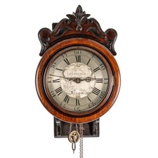 A MAHOGANY 30 HOUR WALL CLOCK