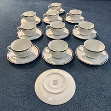 Ten White And Silver Cups And