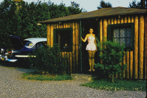 Sexy young woman door of - sexy,