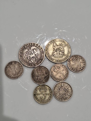 One shilling three pence - one,